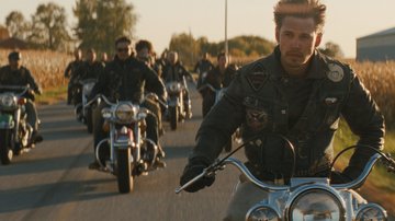 Austin Butler staring as Benny rides his motorcycle with group of riders