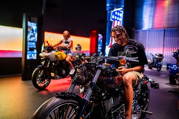 Person sitting on Harley-Davidson Imagination Station