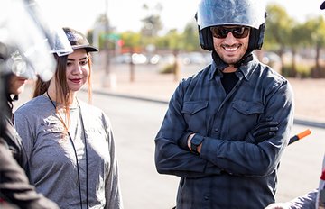 Motorcycle training instructor with student