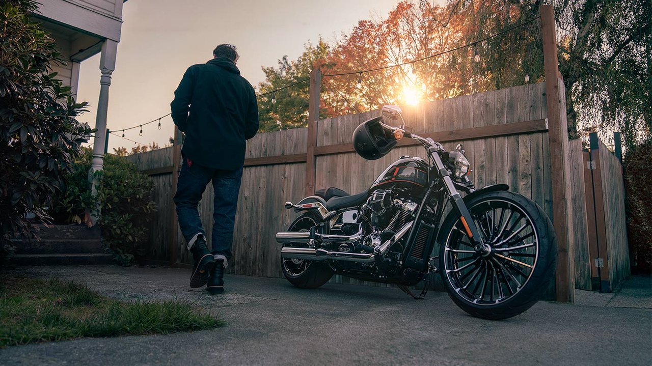 Man standing near motorcycle 