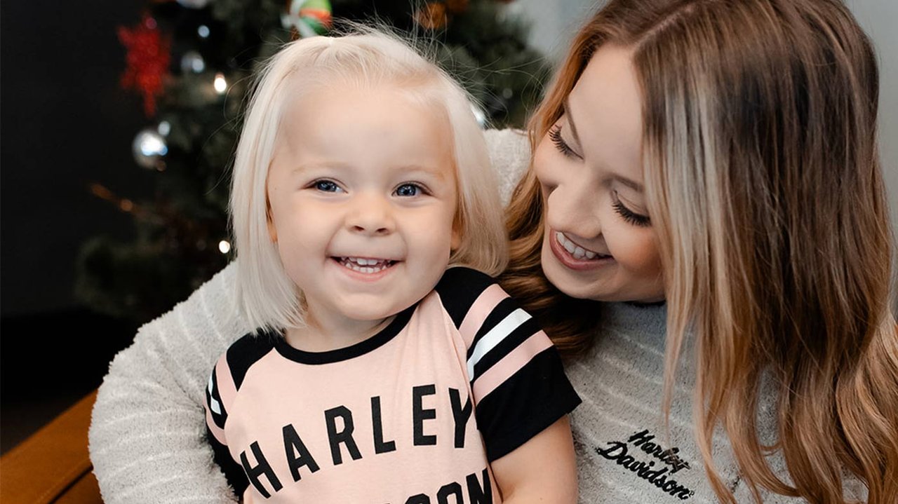 Mother and daughter pose for photo