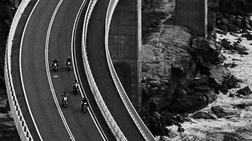 motorcycles on a bridge, black and white